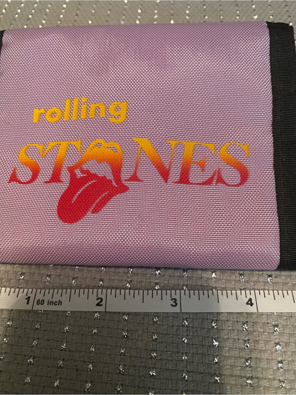 the Rolling Stones Kids Lavender Trifold Wallet with Red Tongue Logo